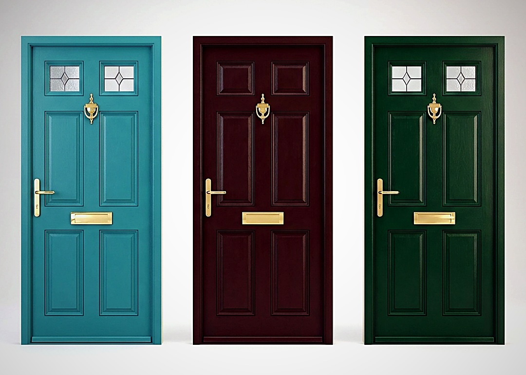 Close-up of brass door hardware on a UK-style panelled door